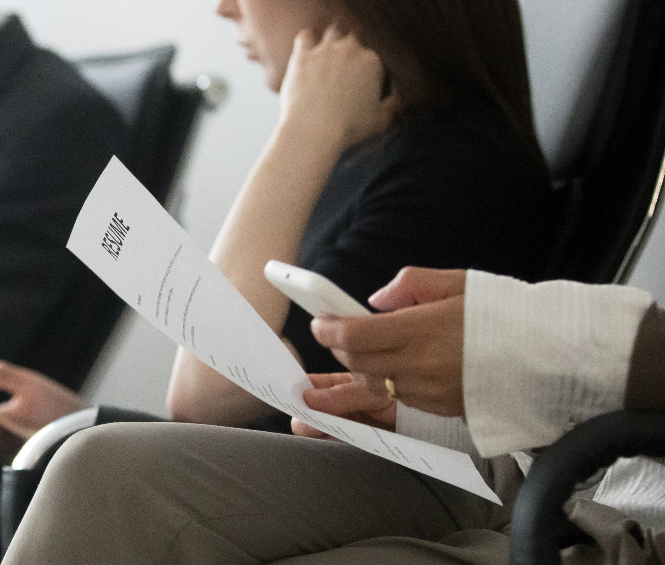 Side horizontal photo multiracial people sitting in queue waiting interview